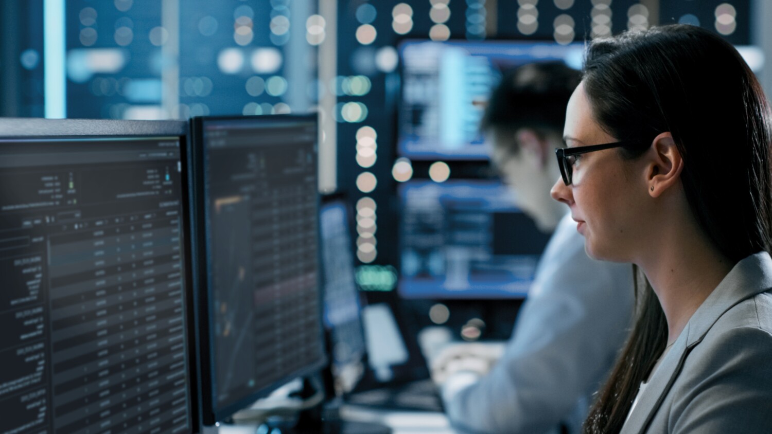 Engineer viewing screens as part of network management and optimization role.