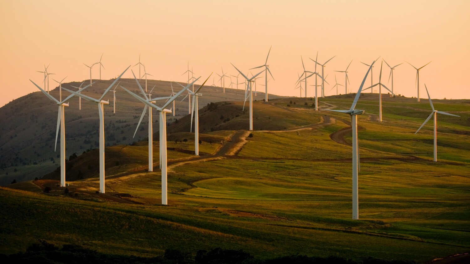 Wind power turbines on a hill side.