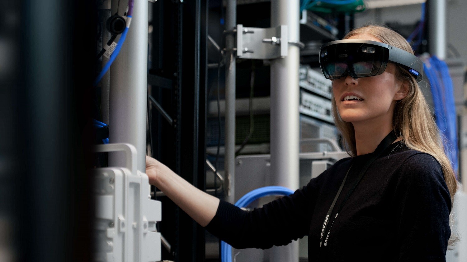 Woman using AR hololens.
