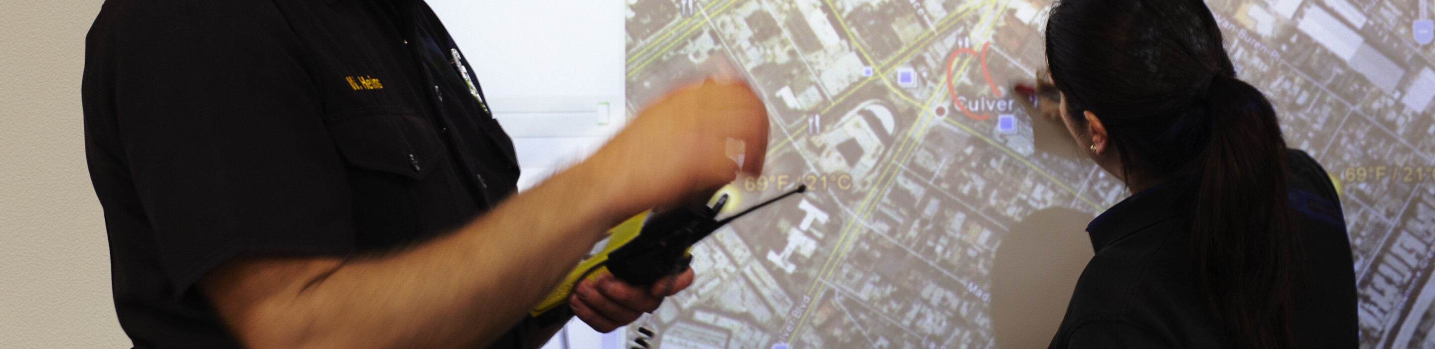 Fire brigade officers and a map.