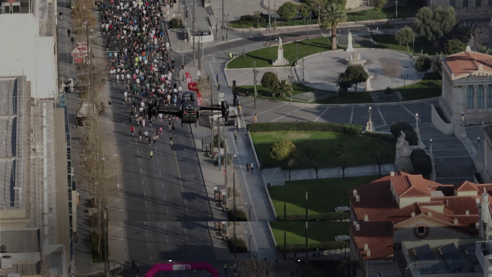 Drone monitoring a large city event.