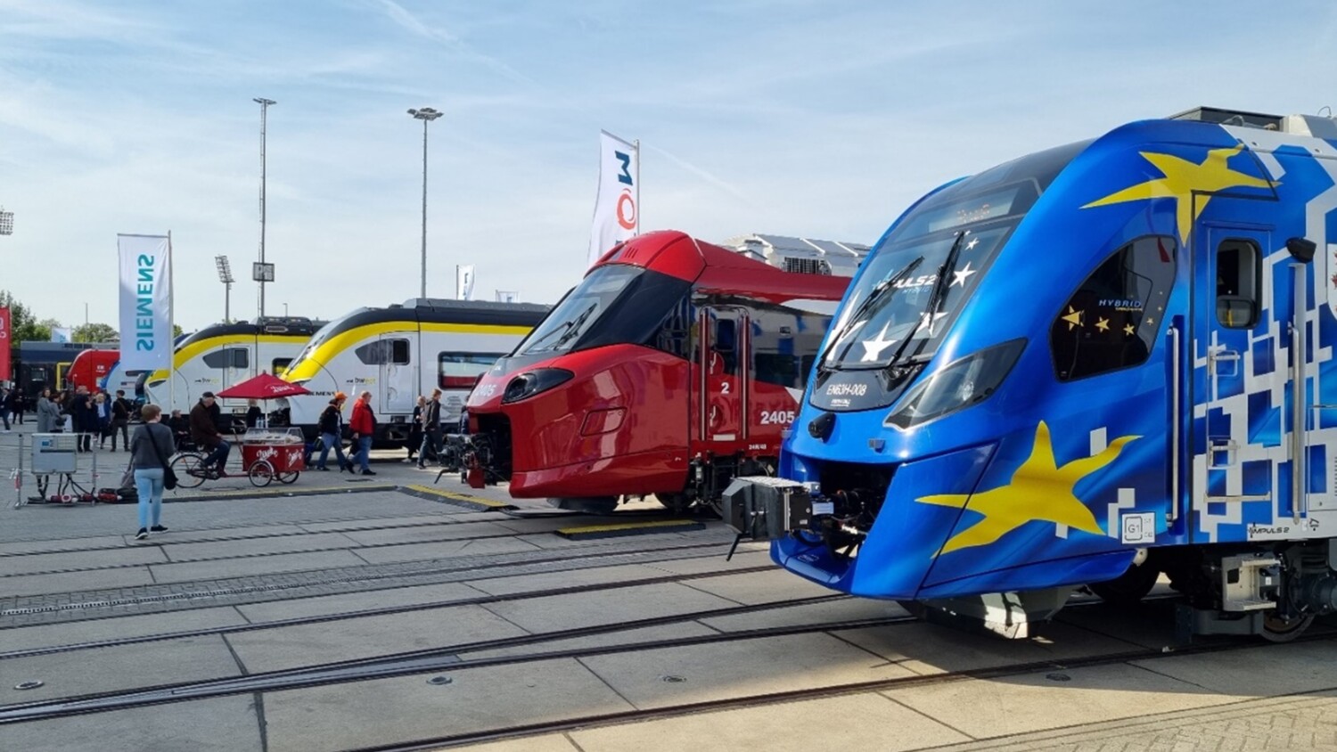 Outdoor railyard with trains on display at InnoTrans 2022