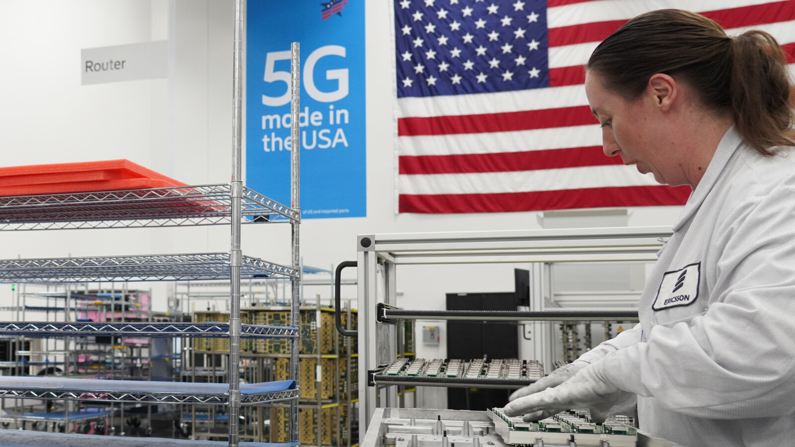 Employee working on electronic components in a production facility.