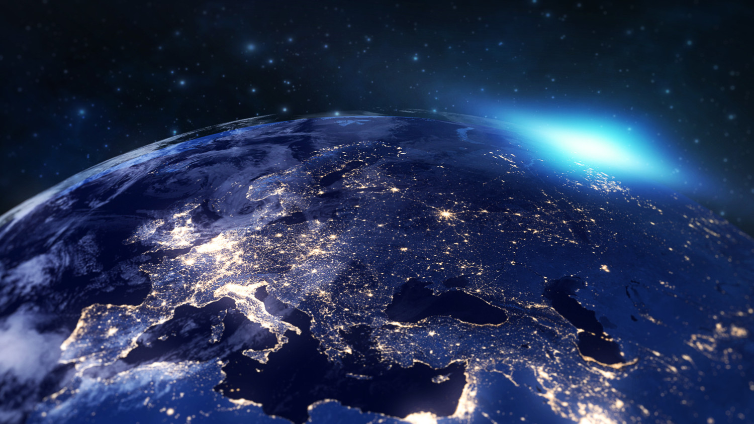 An image of the Earth from space showing cities as glowing spots.