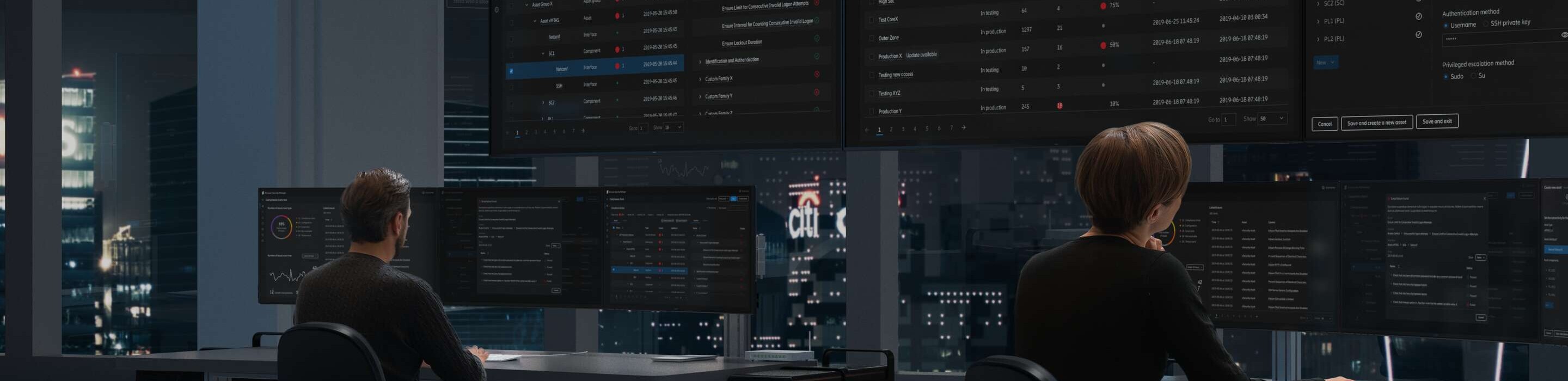 People working in a dark room in a Security Operation Center 