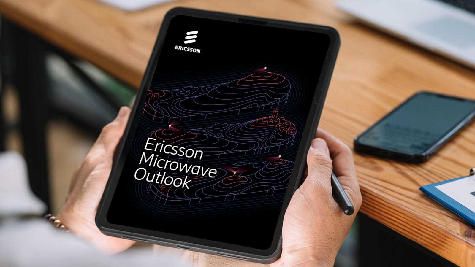 Ericsson Microwave Outlook report shown on a tablet screen.