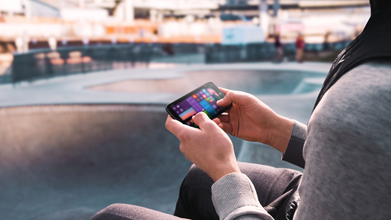 Hands holding a gaming device.