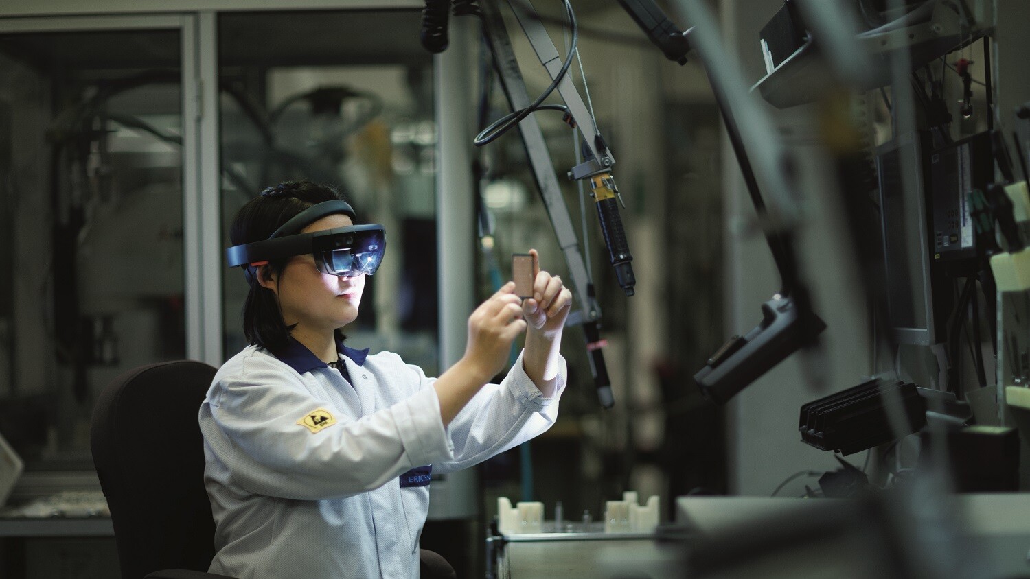 Woman in factory in VR glasses
