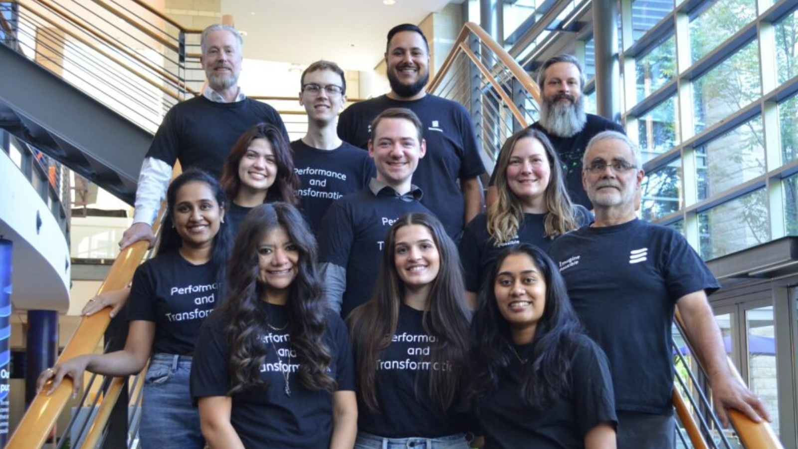 Emily Selvera and her team wearing Ericsson merch in the office.