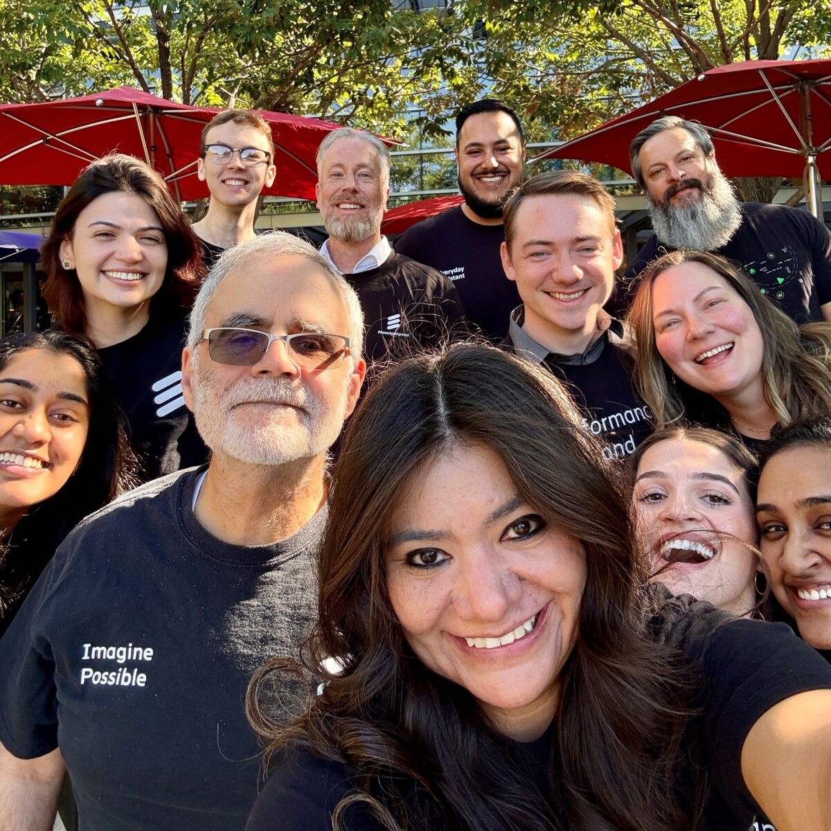 Emily Selvera and her team taking a selfie in Ericsson merch.
