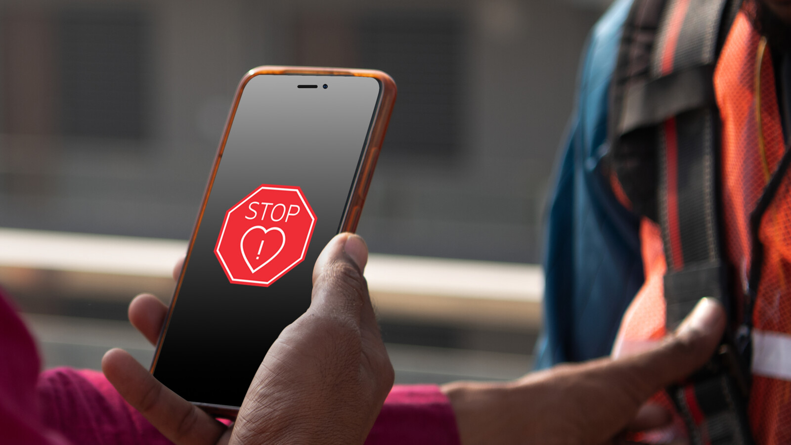 Person holding mobile telephone doing an inspection.