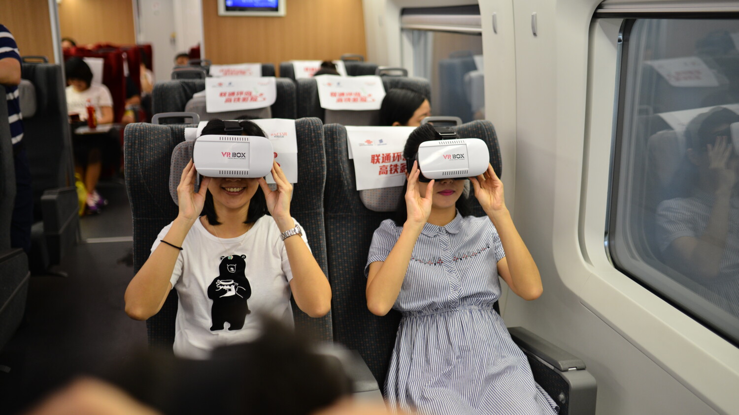 Virtual Reality users on a train