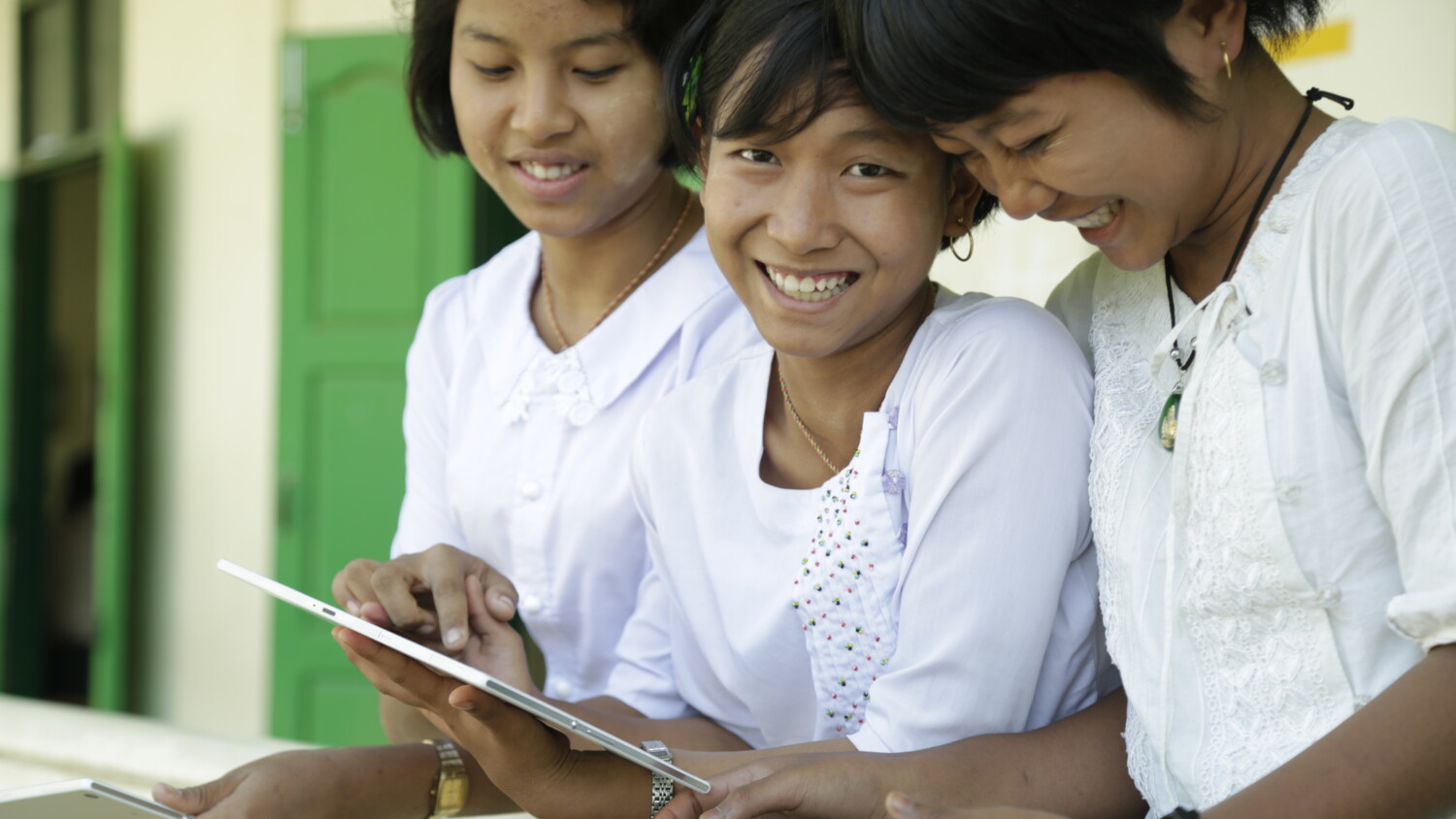 School girls with a tablet.