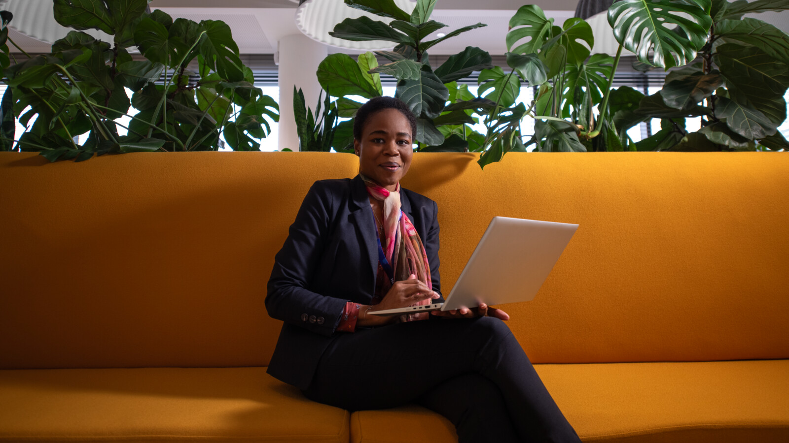 Woman on yellow couch