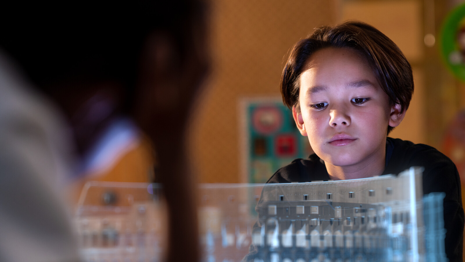 Boy student experiencing immersive learning with 5G hologram