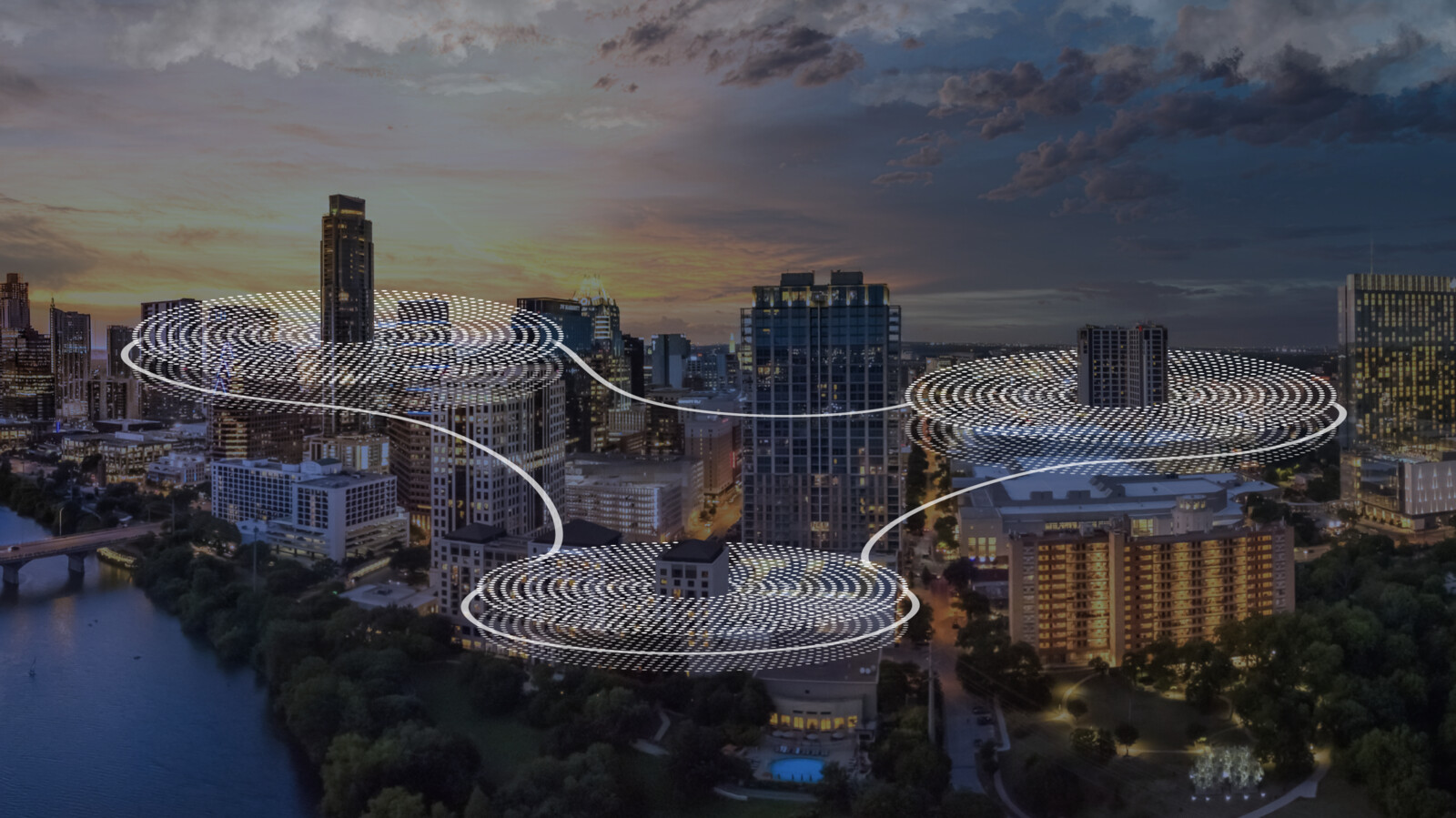 Cityscape with graphic overlay representing cloud infrastructure.