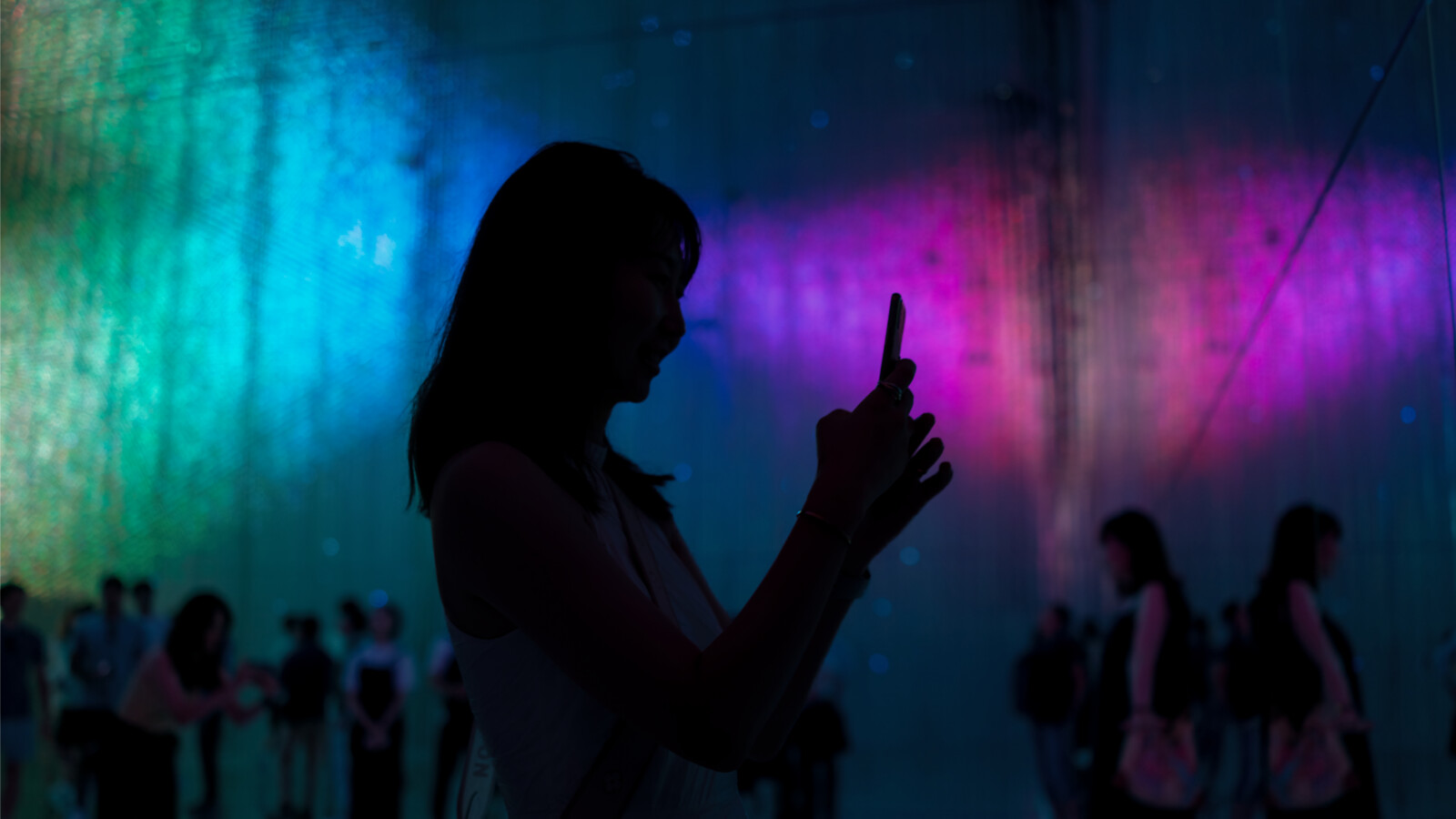 A woman interacts with a phone