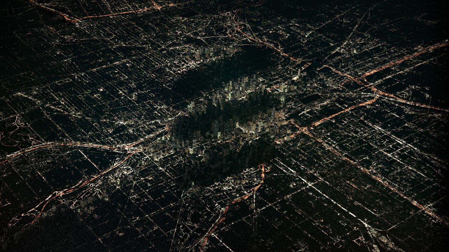 City lights glowing in the dark, coordinated by IoT technology to reveal the Ericsson icon