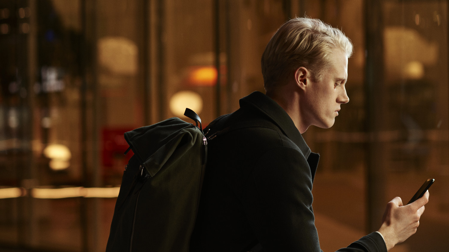 man looking at phone