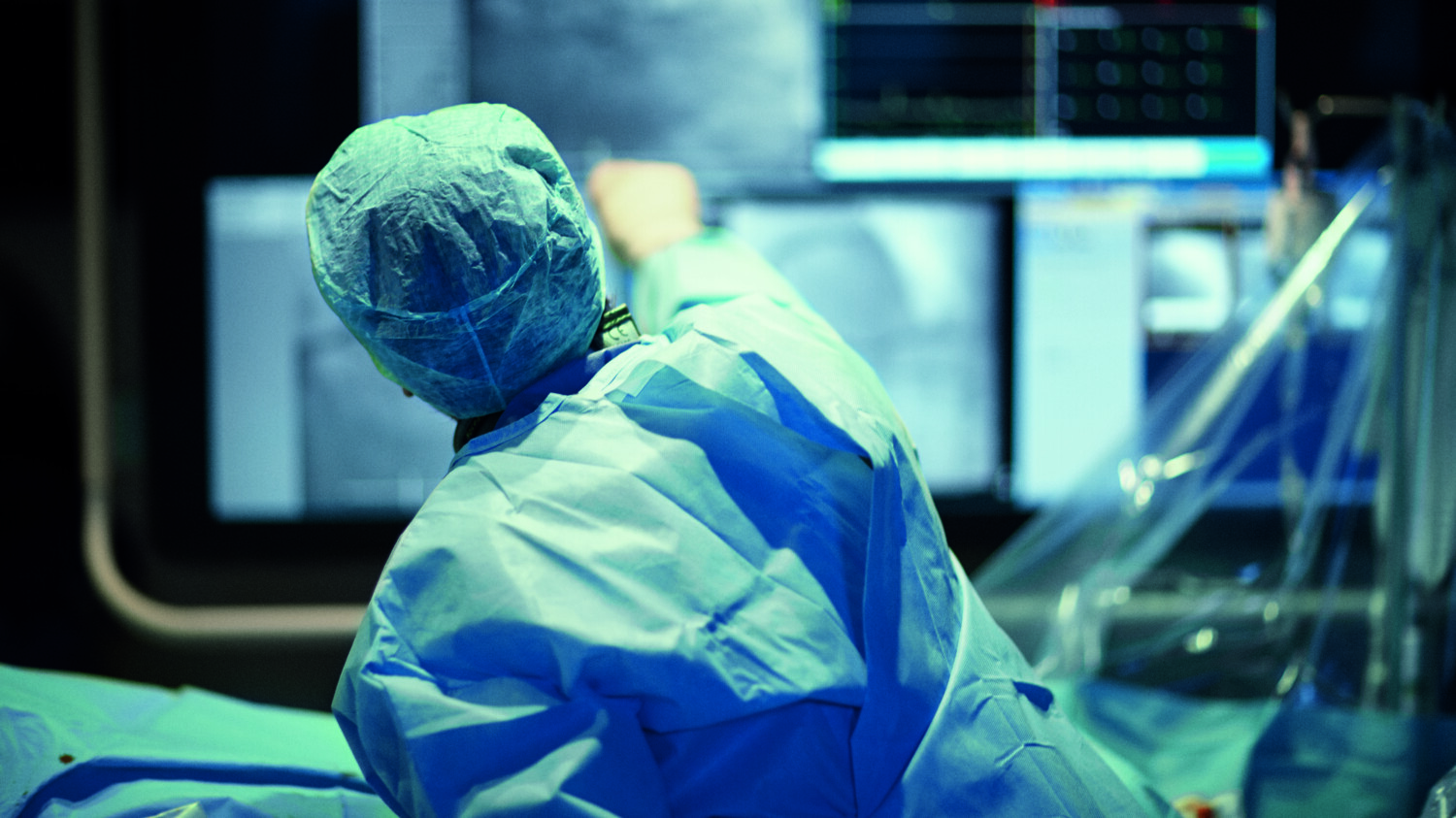 Medical staff using remote robotic assisted surgery.