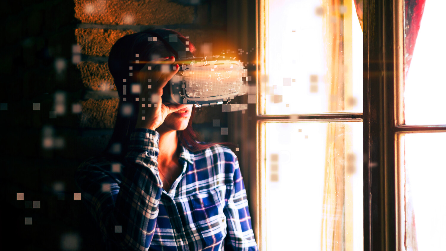Person in VR headset interacting with pixelated interface.