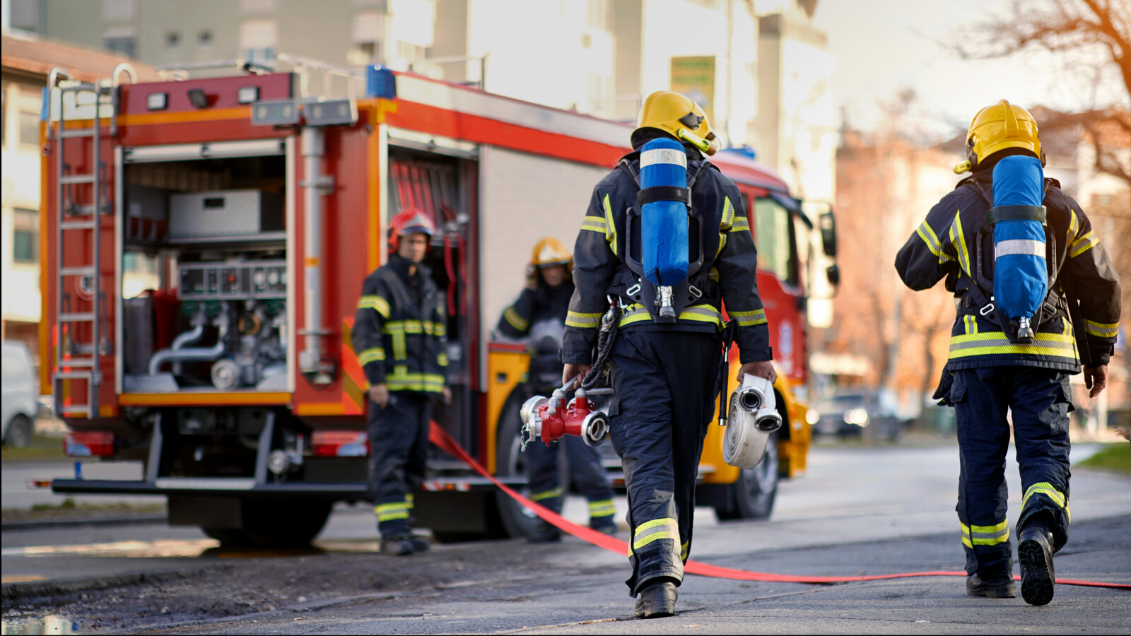 Firefighter walking to a firetruck