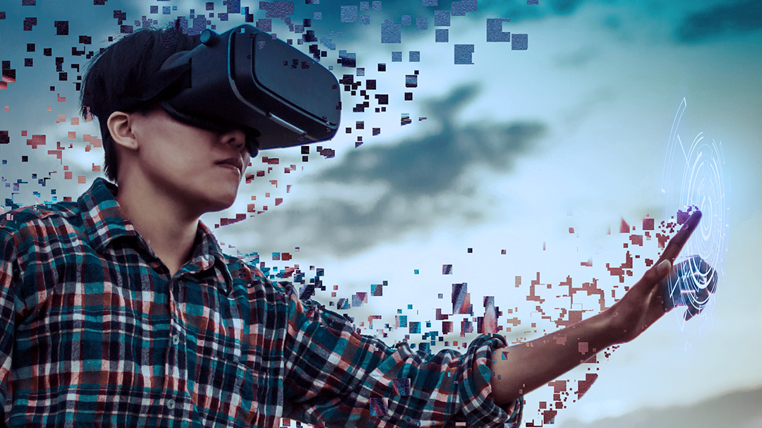 Person in VR headset interacting with pixelated interface.