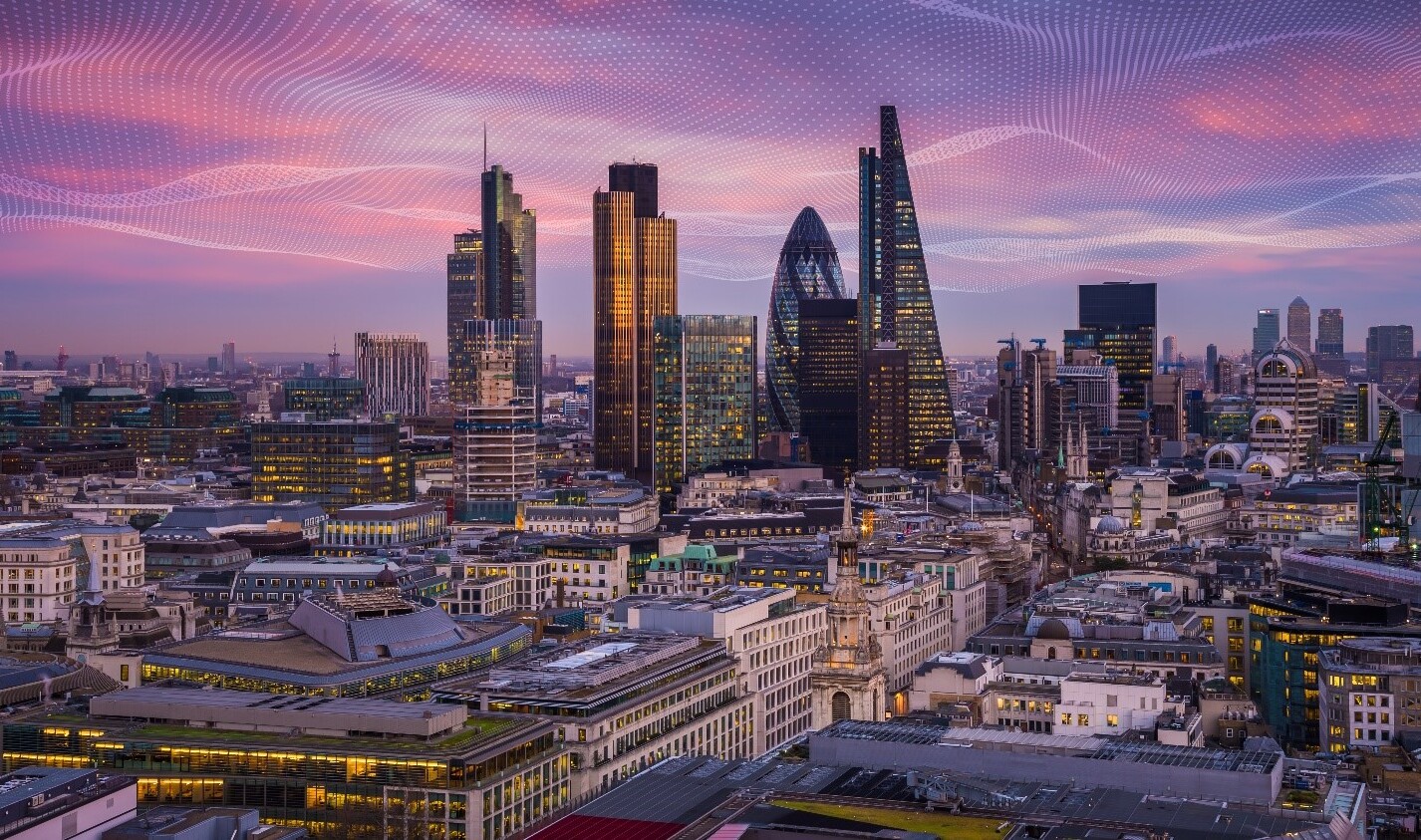 Cityscape with graphic overlay representing connectivity.