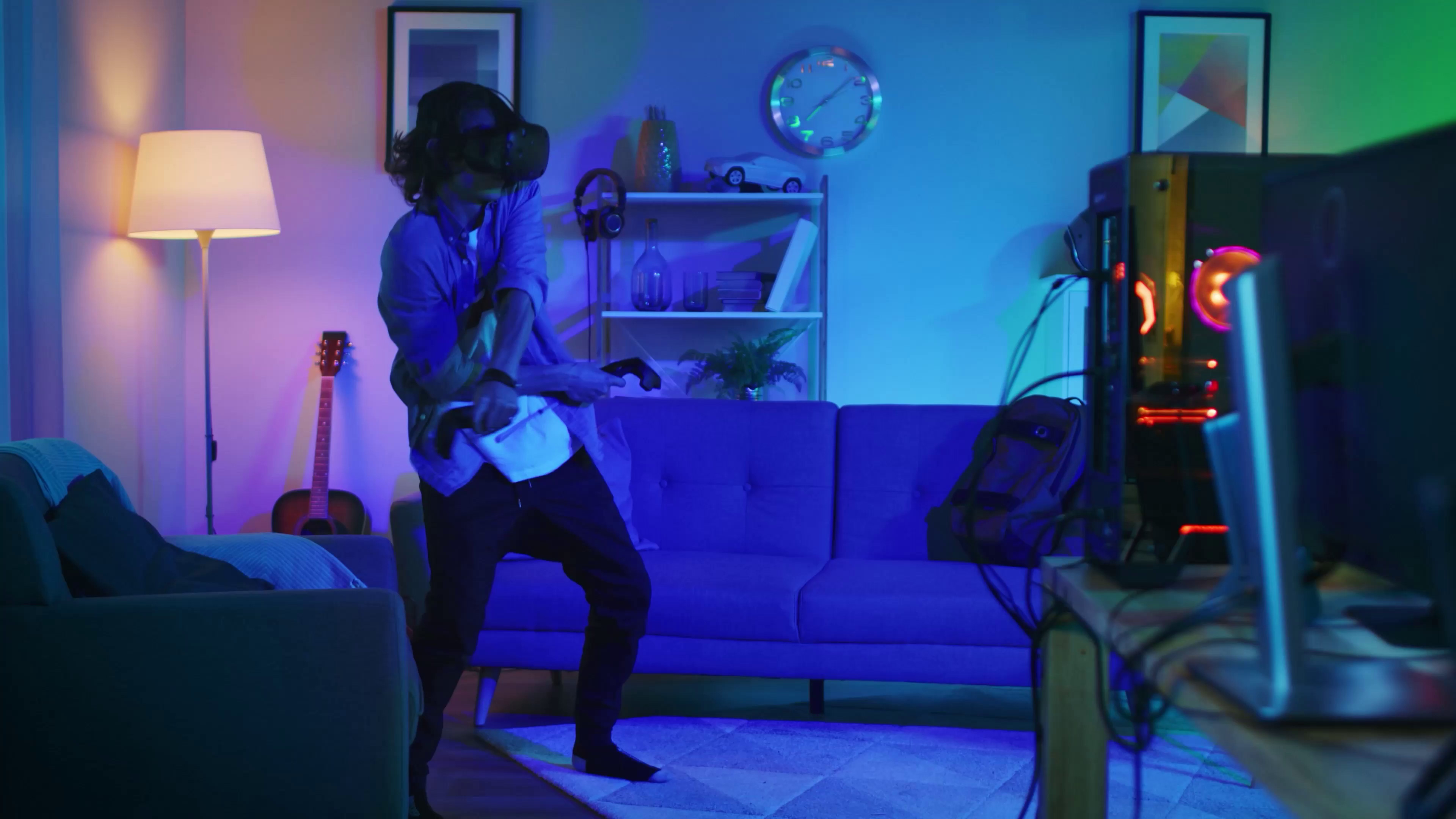 A gamer with VR glasses in front of the screen