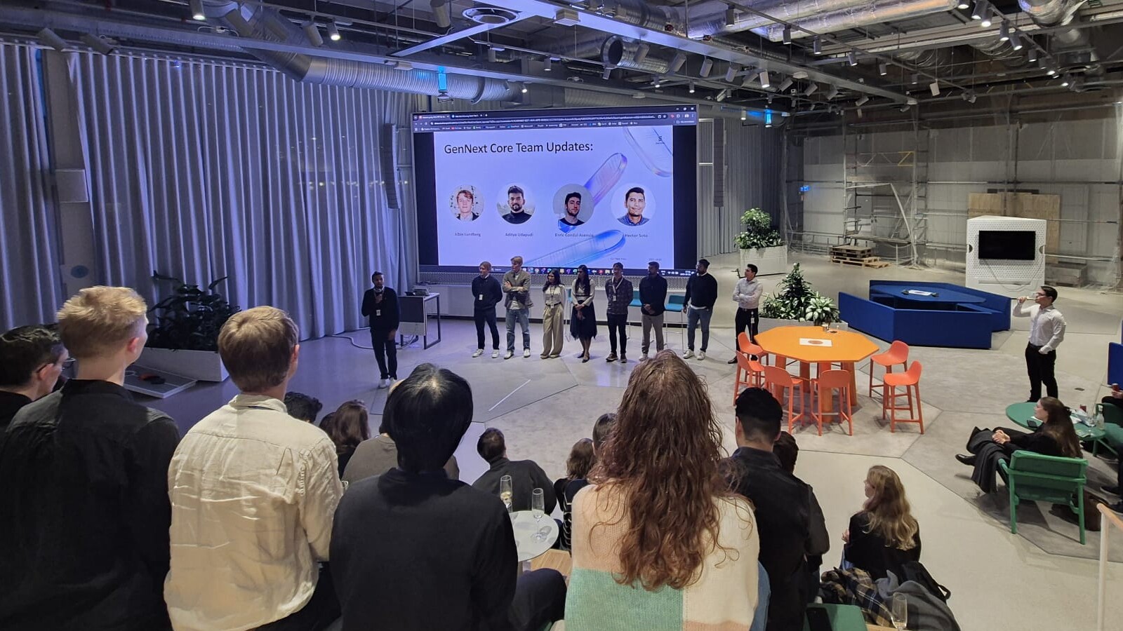 people listening to presenters