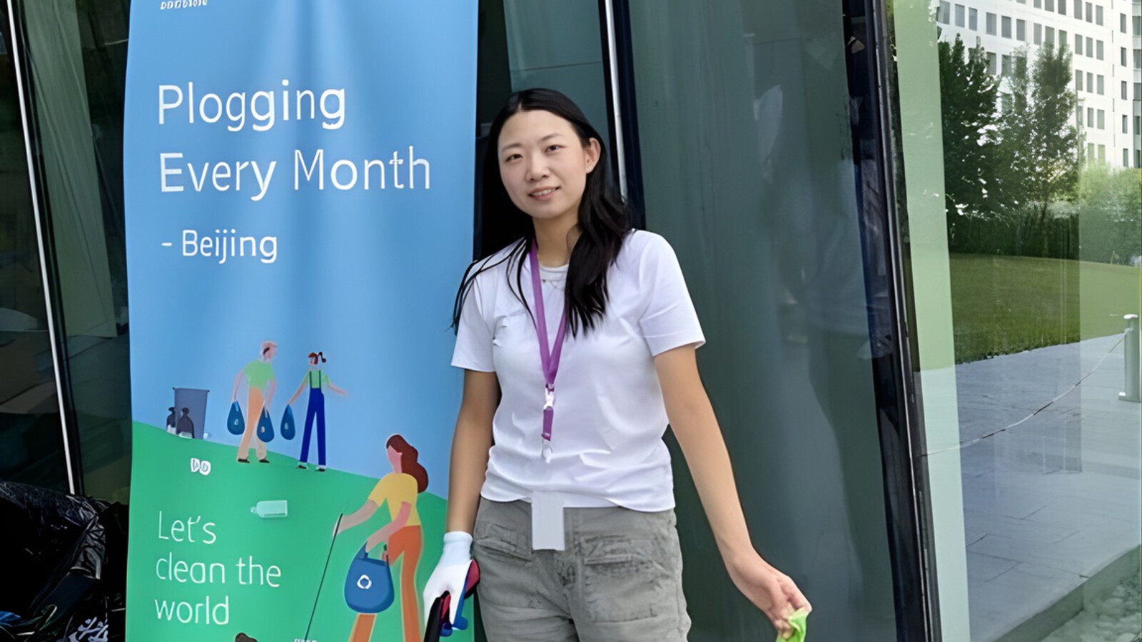 Cloris outside with a litter-picker and a bin bag