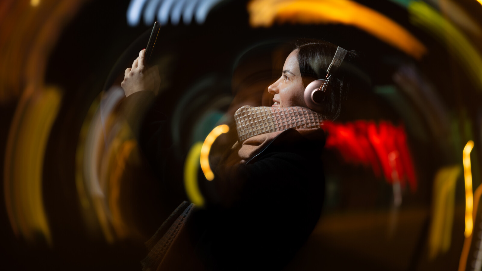 woman using her mobile device outdoors.