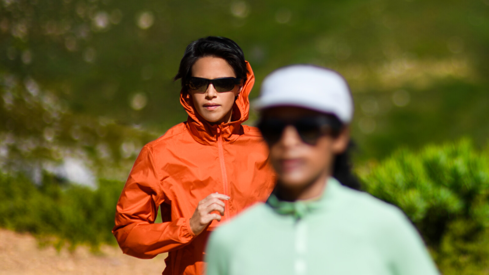 Two women wearing AI glasses while exercising. 