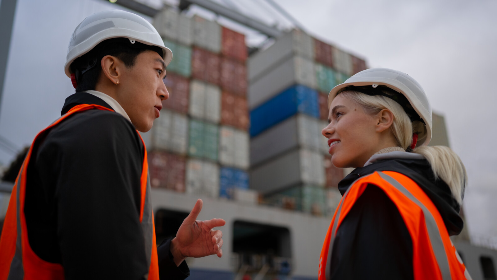 Two colleagues or customers collaborating at harbor