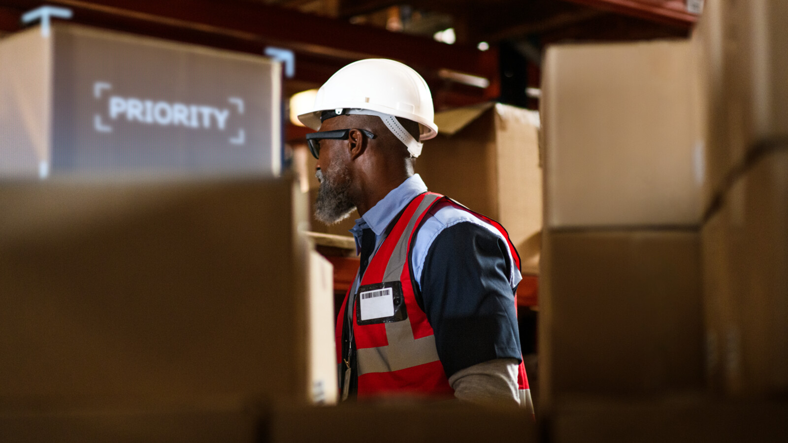 A man with augmented reality glasses working in a warehouse
