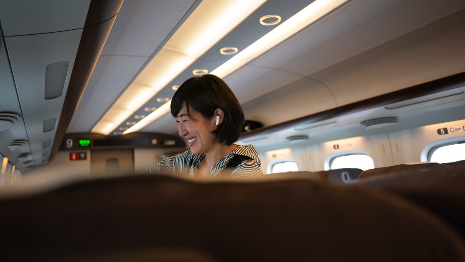 Woman smiling on train