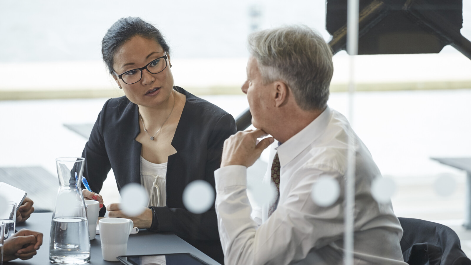 Two colleagues or customers discussing