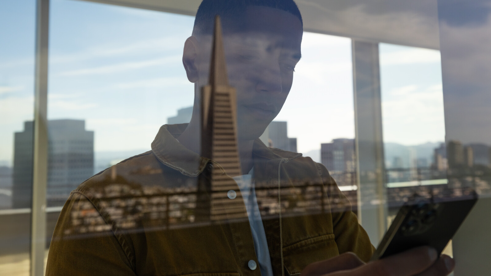 Man with reflection of the city
