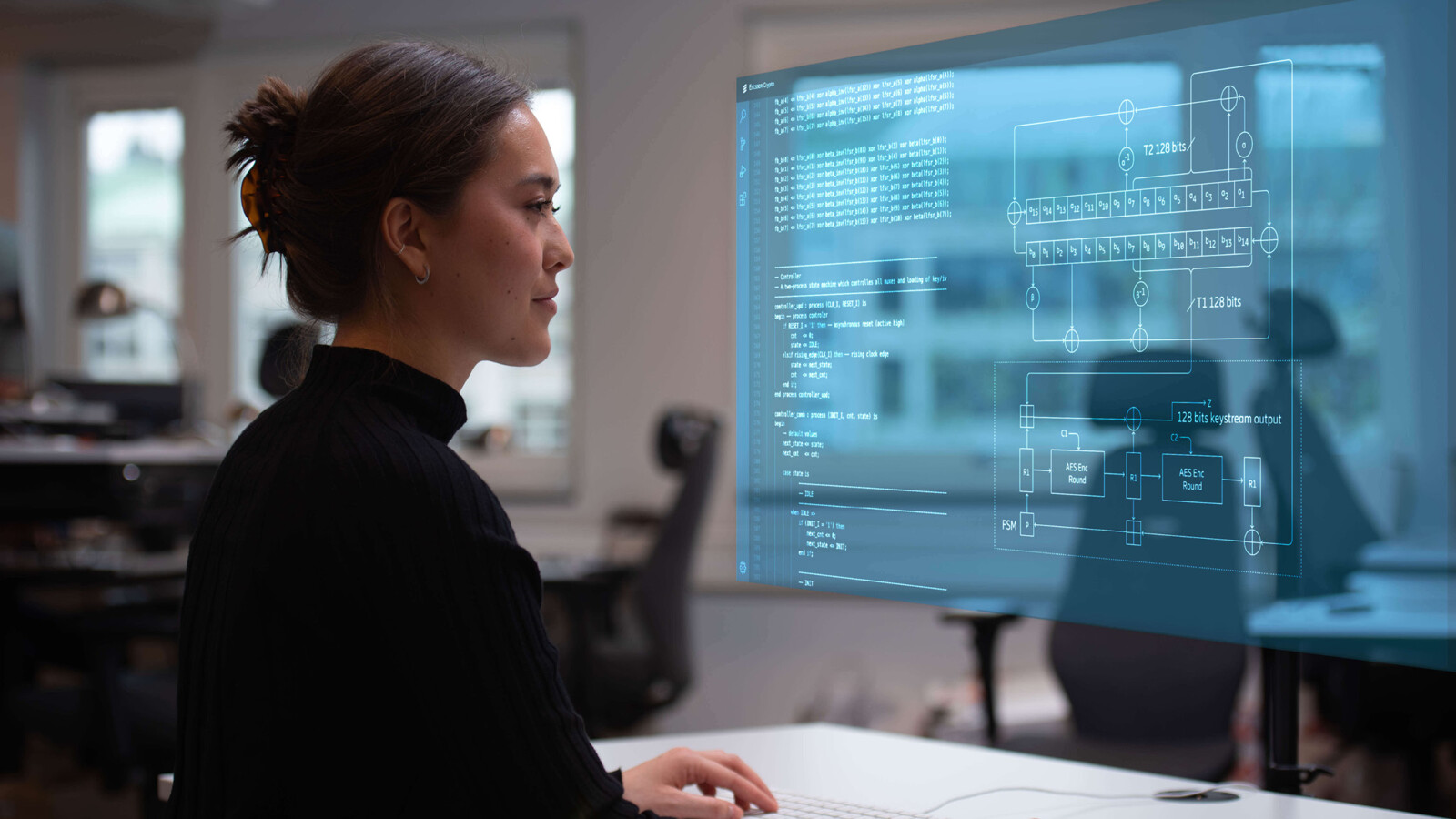 Engineer reviews network management schematics onscreen.