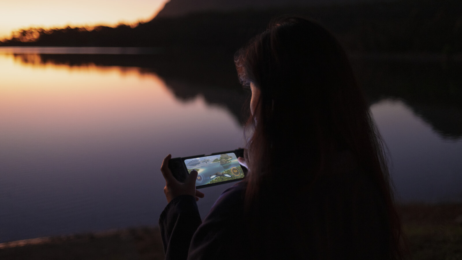 A woman playing a game over 5G on her phone