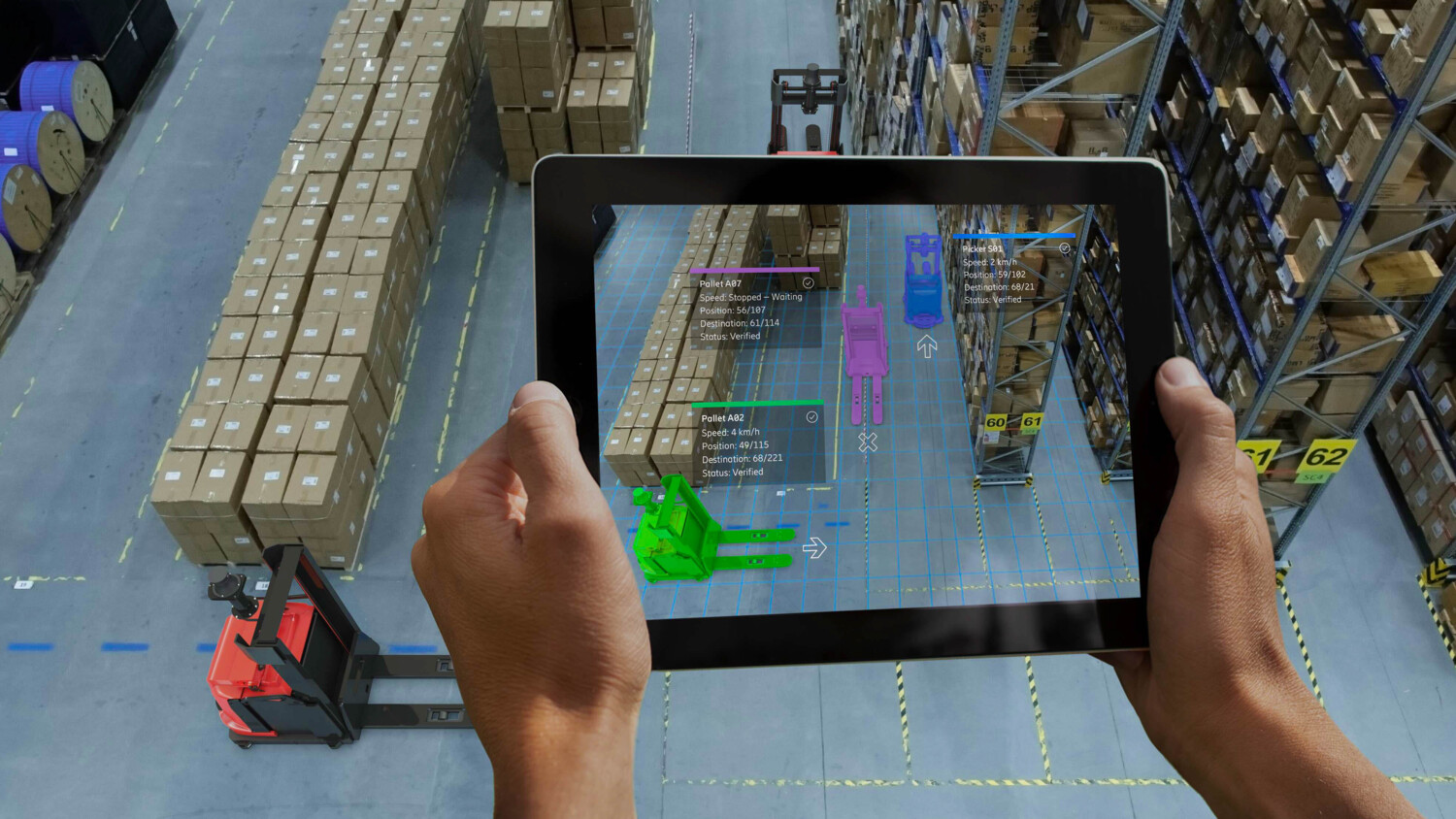 Person in warehouse using AR app for inspection of autonomous forklifts.