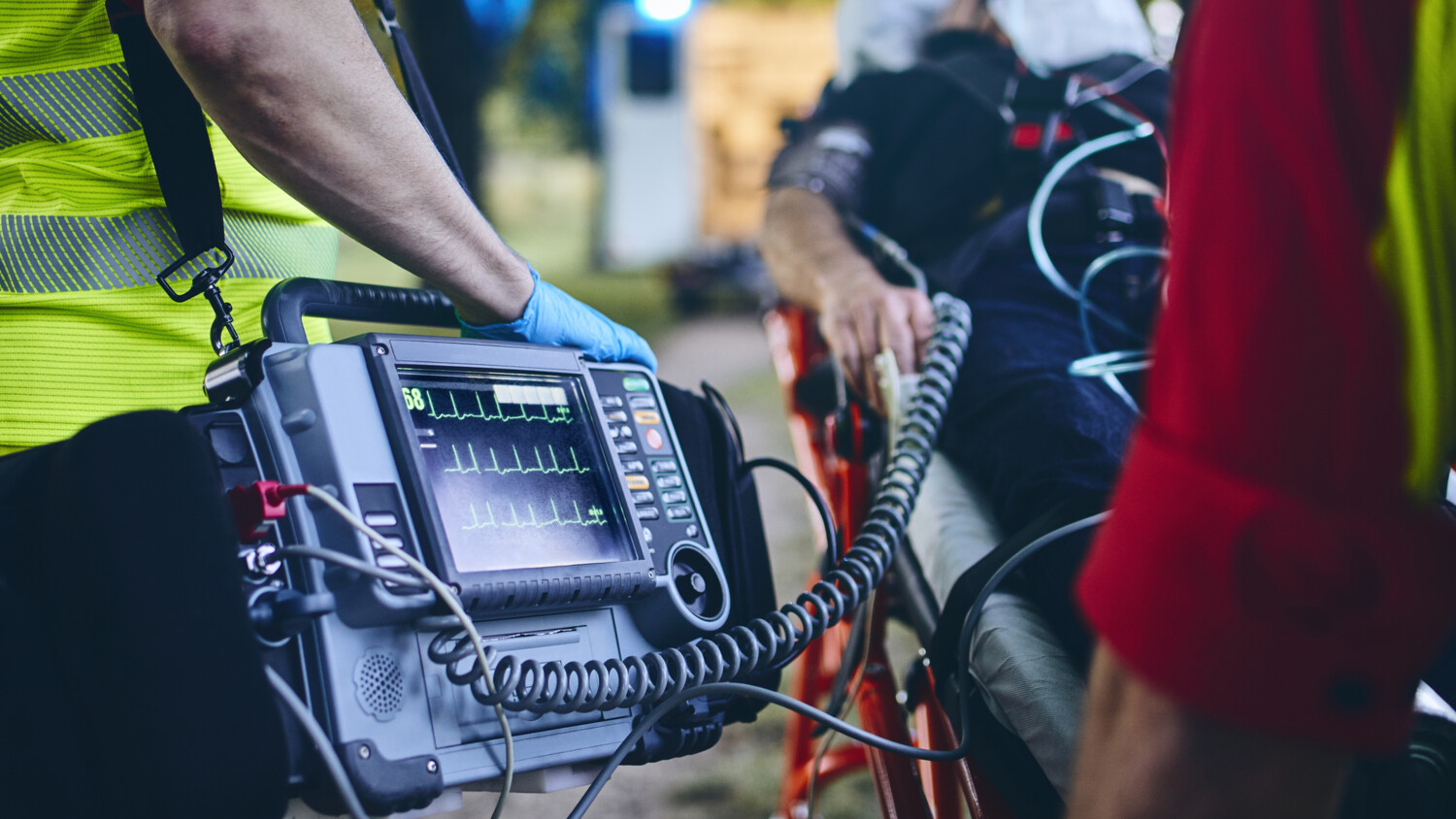 Paramedics with patient and equipment.