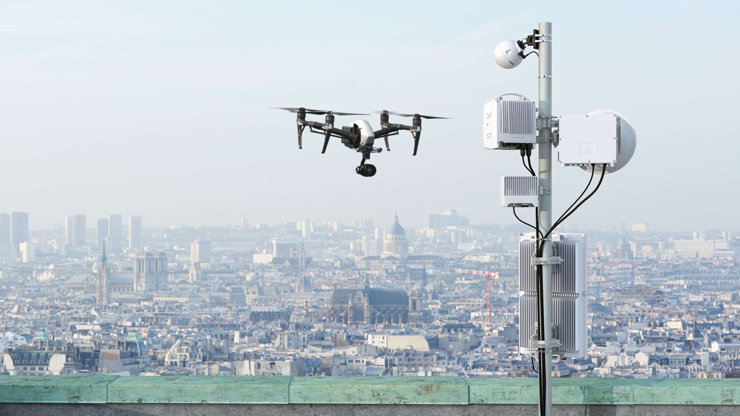 Video surveillance by drone with city skyline in the background.