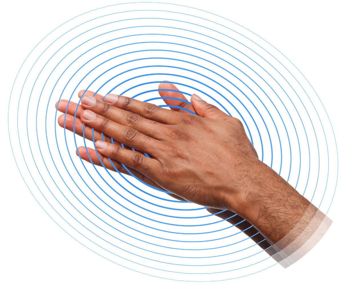 Two hands creating friction by rubbing together with blue graphical circles coming from the center, highlighting energy harvesting.