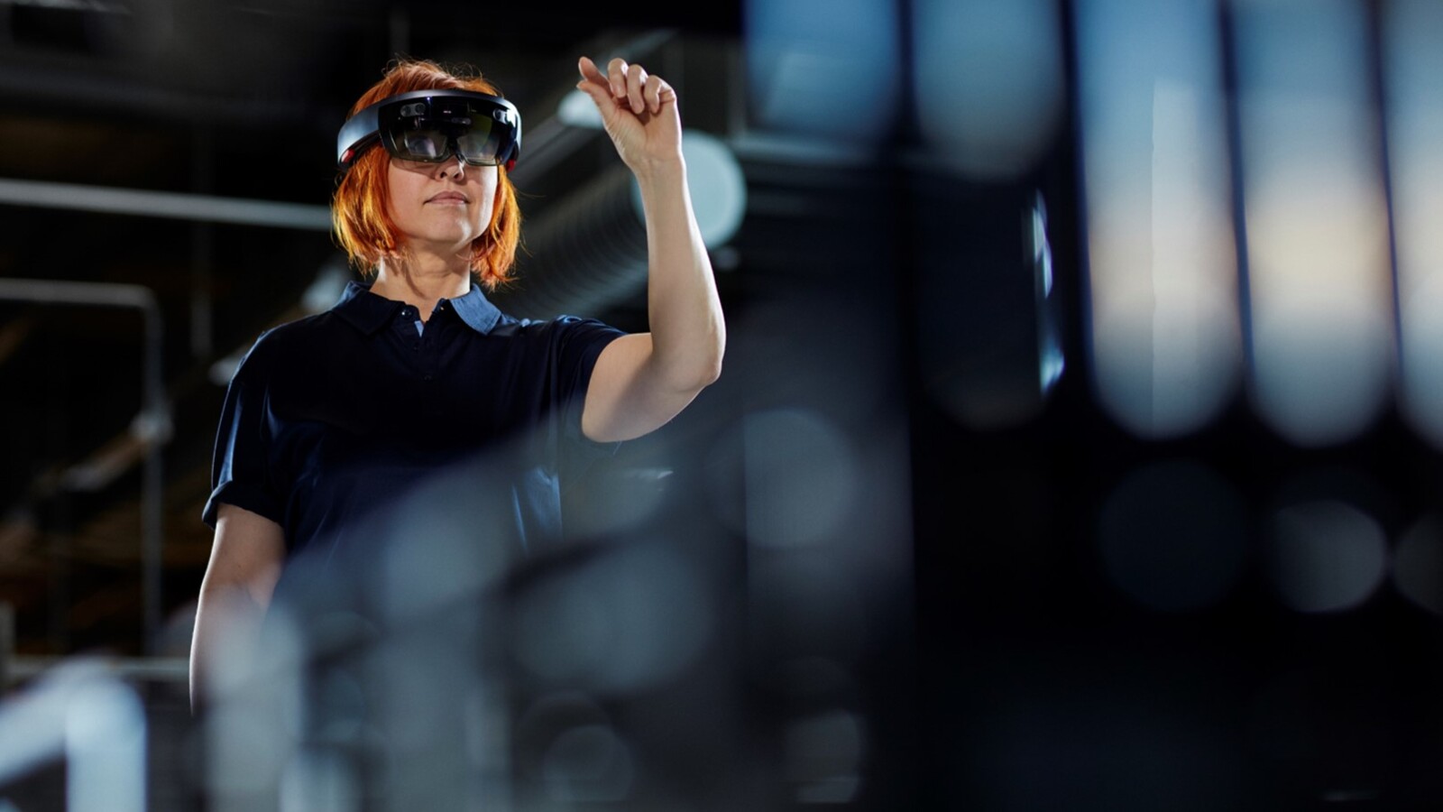 Woman with VR glasses in a factory.