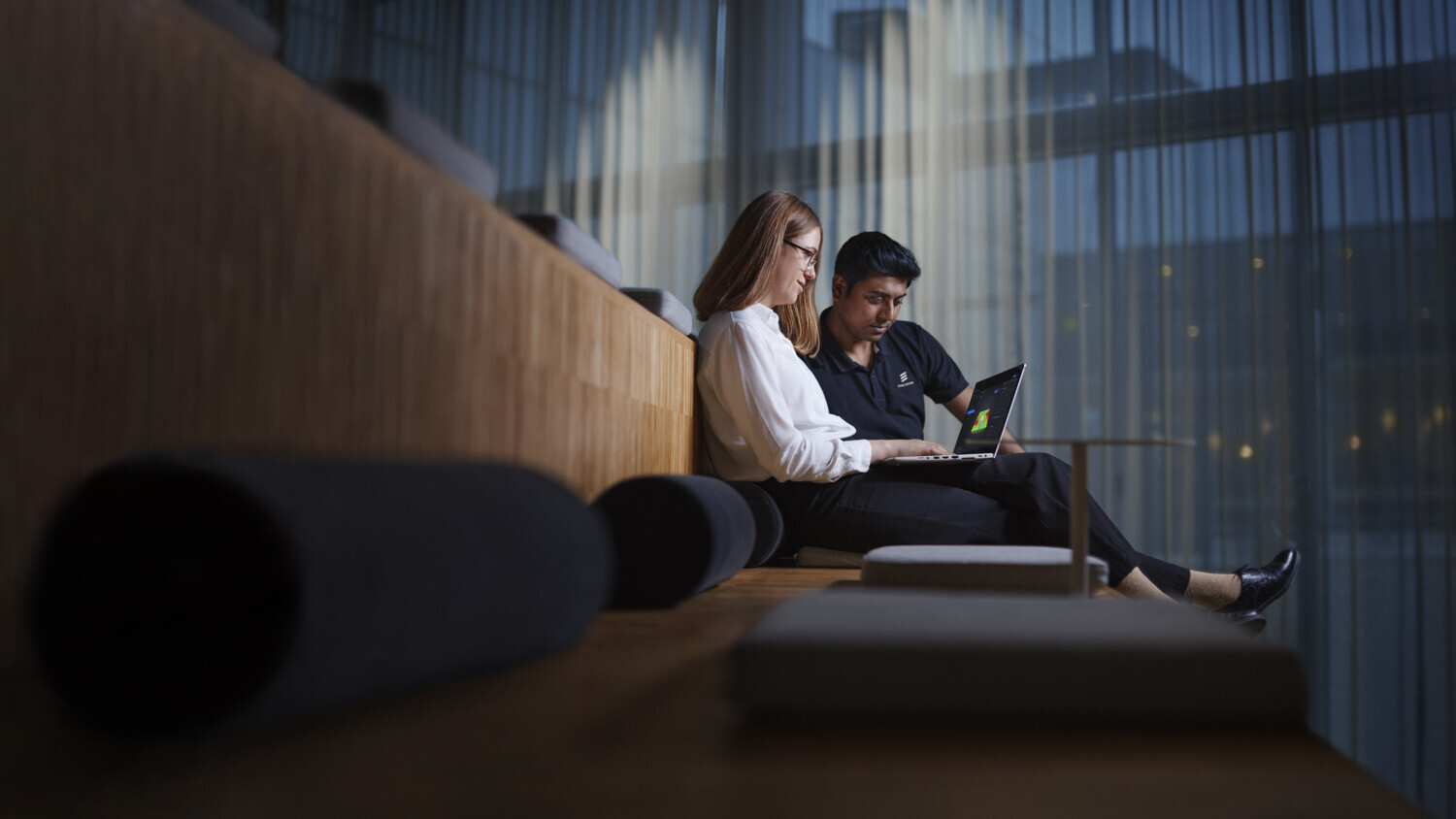 Two persons collaborating.