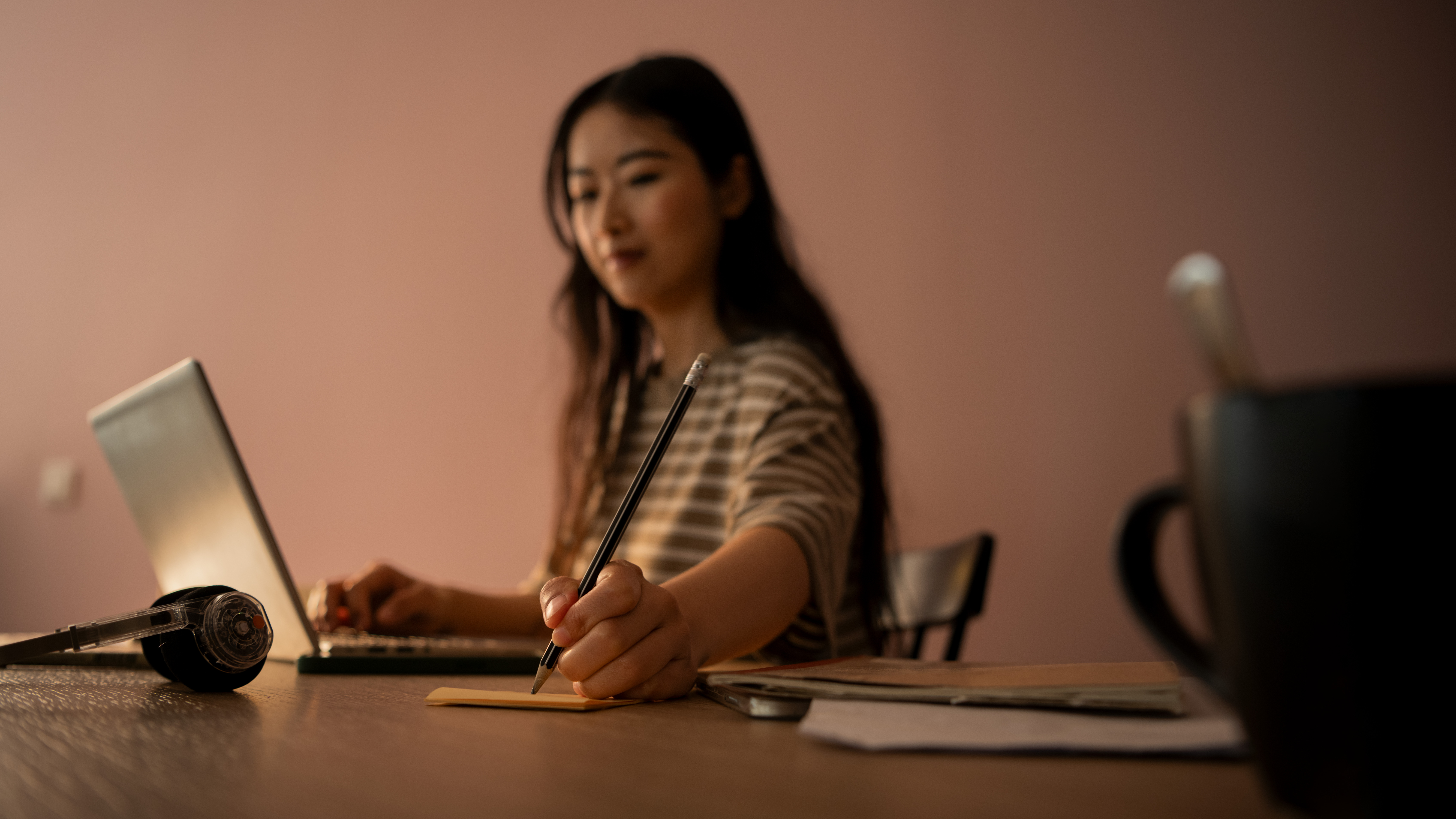Student working on laptop.
